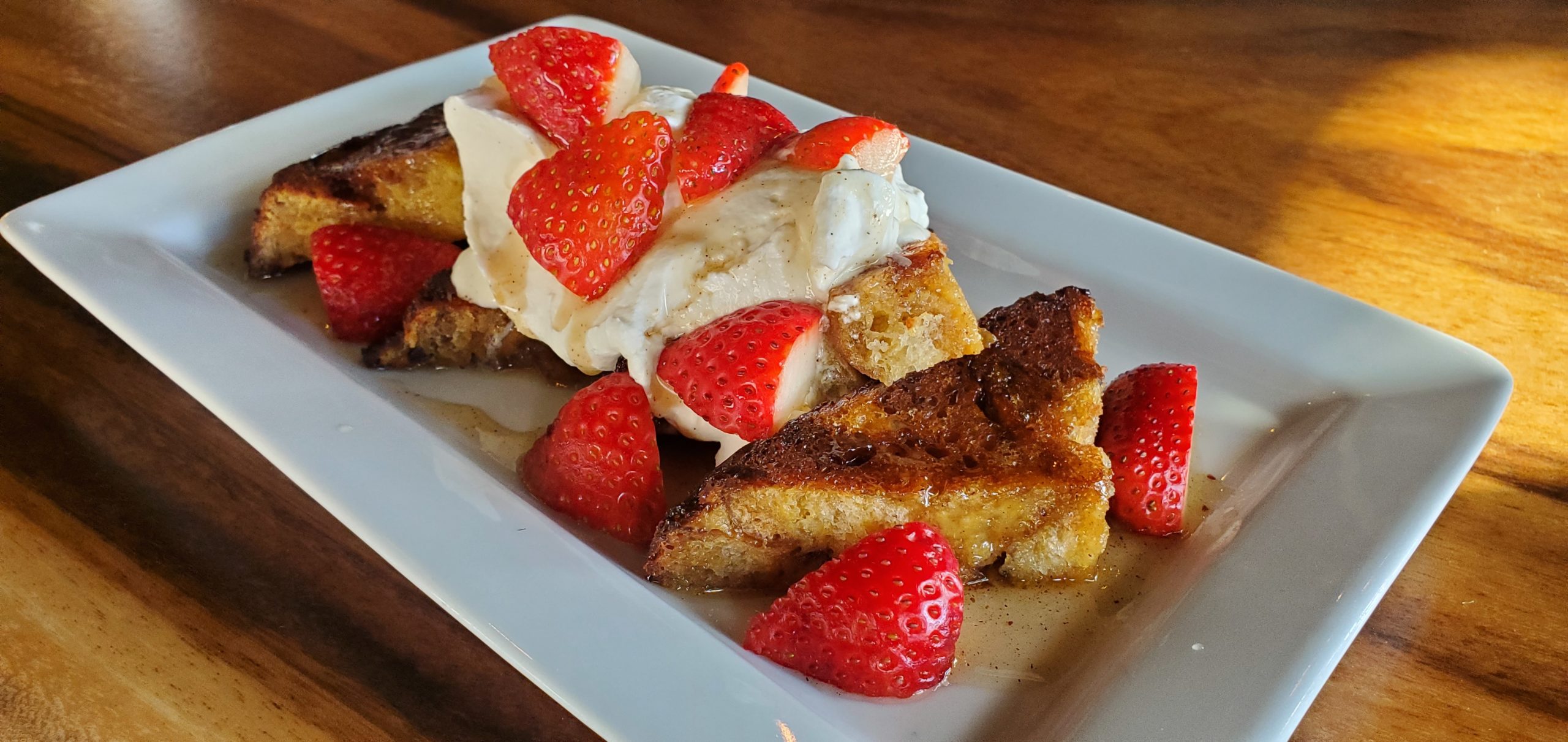 Brioche French toast with vanilla cream and fresh strawberries